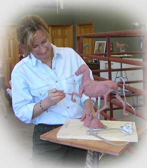 Sondra sculpting "Rack On" in a workshop in Taos